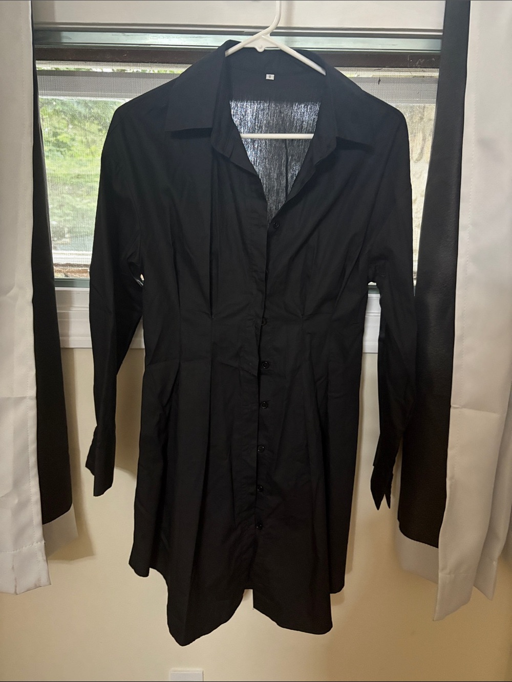 Black Button-Front Women's Shirt dress. Slightly fitting waist. Never worn
